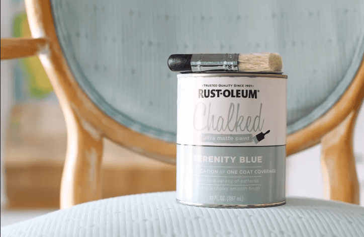 A can of chalked blue paint on the chair